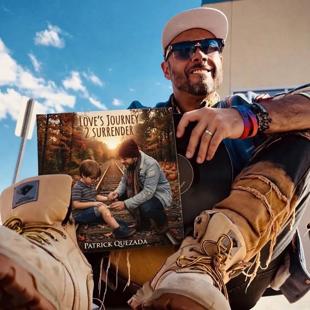 Patrick Quezada sitting outdoors holding the Love's Journey 2 Surrender album cover with a vinyl record